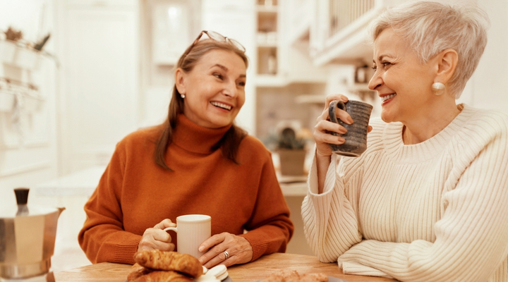 Two friends talking over a coffee.