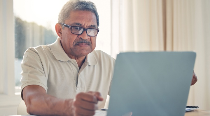 A man using a laptop.