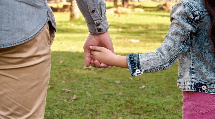 rent and child holding hands.