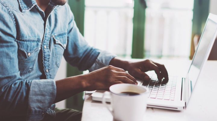 A man working from home on a laptop.